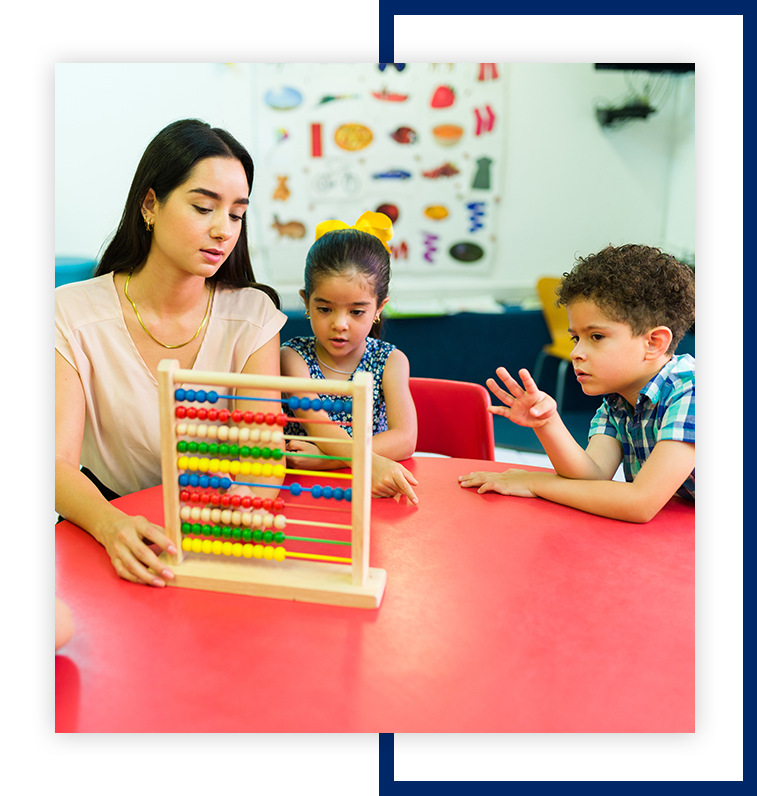 A woman and two children are playing with an abacus.