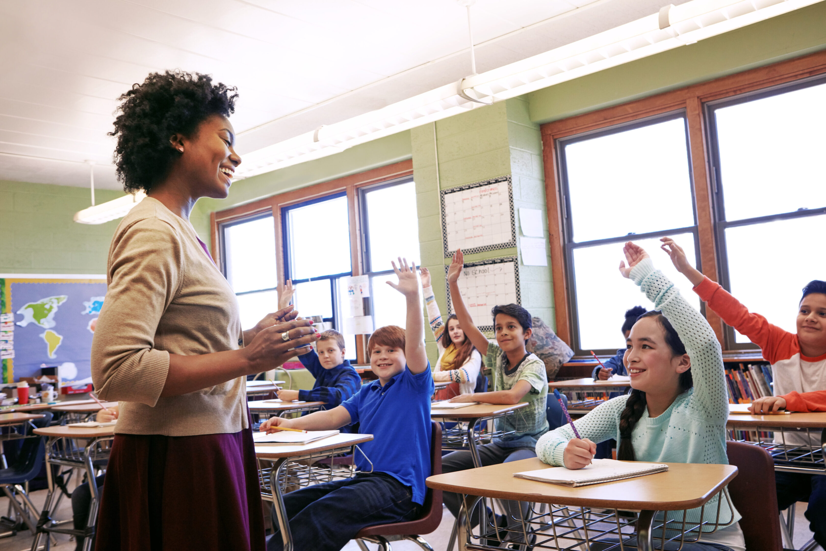 A teacher is giving students instructions in class.